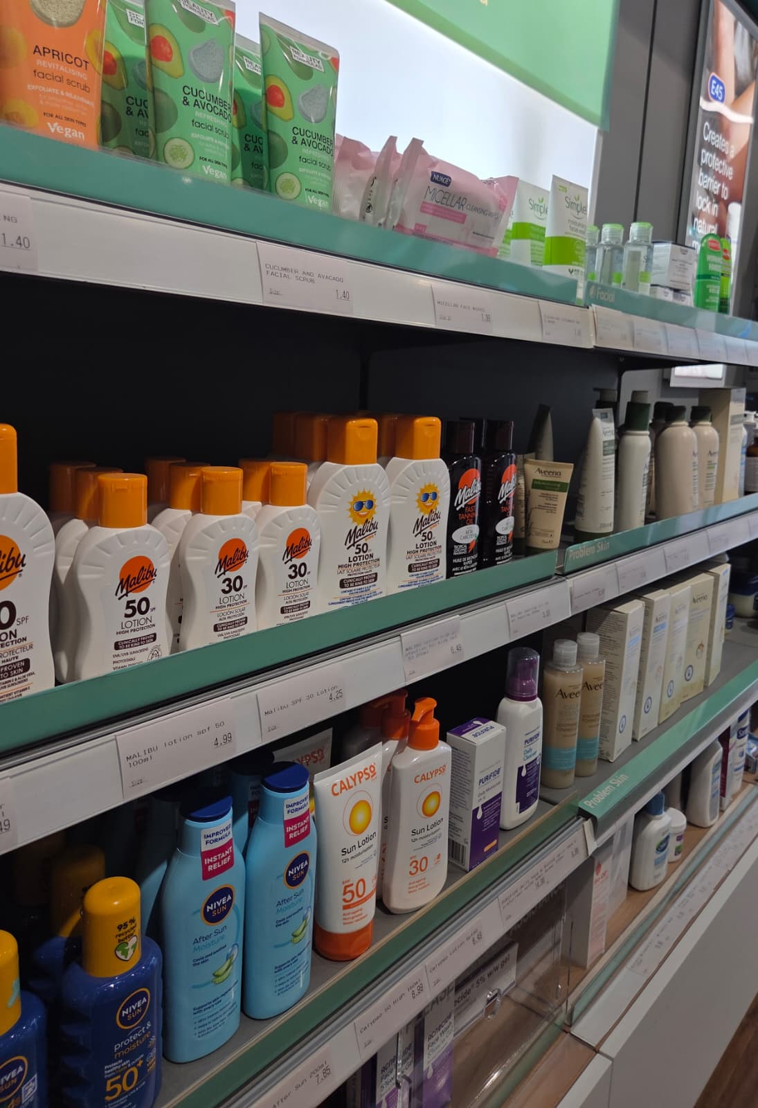 Sun protection lotions on the shelf at Medicine Stop, Alfreton.